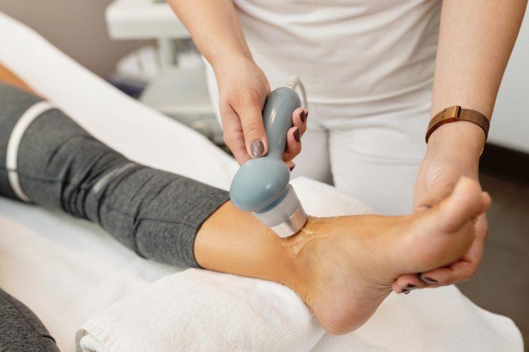 closeup-physical-therapist-treating-client-s-joint-with-electrotherapy