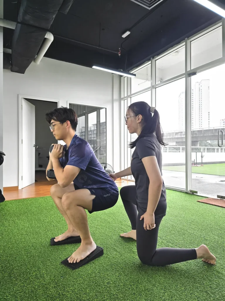 coached-goblet-squat-on-slant-boards