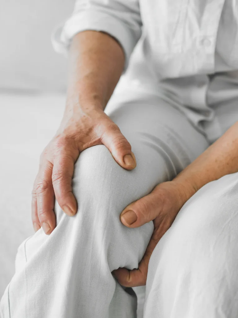 hands-holding-knee-seated