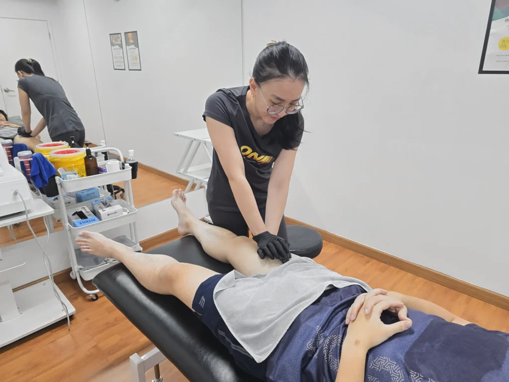 physiotherapist-hands-on-thigh-treatment