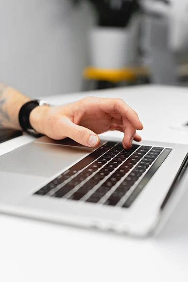 hand-typing-on-laptop